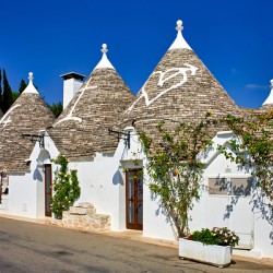 Apulia Puglia Italy. Alberobello. Trulli: traditional Apulian dry stone huts with a conical roof.
