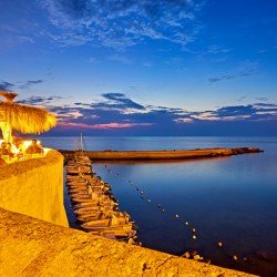 Salento. Apulia Puglia Italy. Gallipoli. Aperitif on the waterfront at sunset.