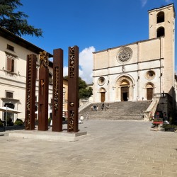 Todi Umbria Italy. Concattedrale della Santissima Annunziata. Cathedral. Piazza del Popolo. The statue Quattro Stele by Arnaldo Pomodoro
