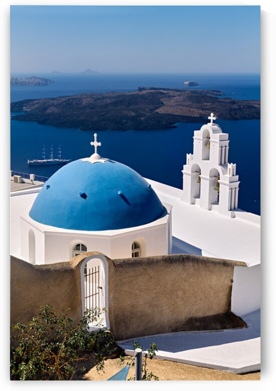 Santorinis iconic blue dome church and caldera seascape. by Marco Brivio