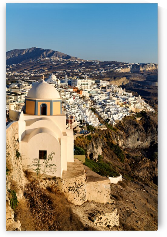 Iconic Santorini village and church overlooking caldera. by Marco Brivio