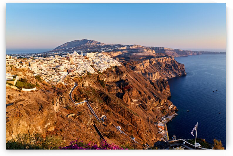 Santorinis iconic white village on caldera cliffs Aegean Sea. by Marco Brivio