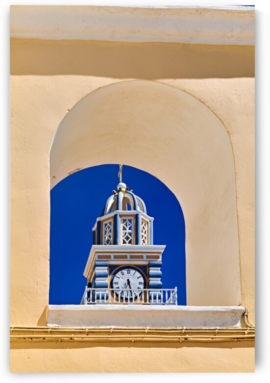 Santorini clock tower framed by arch against blue sky. by Marco Brivio