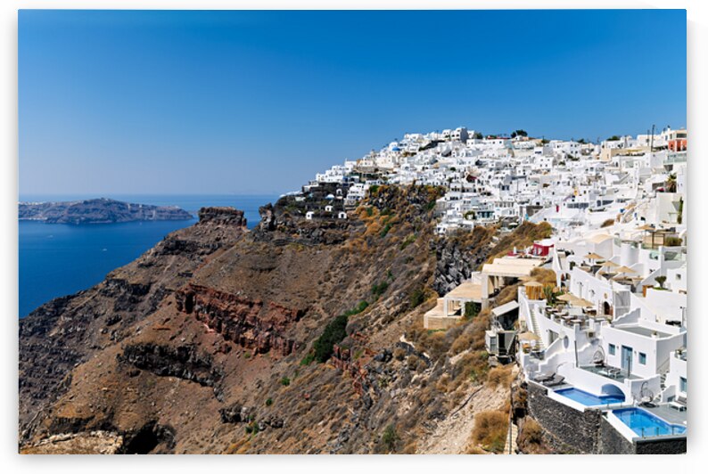 Santorini village on cliff overlooking caldera and sea. by Marco Brivio