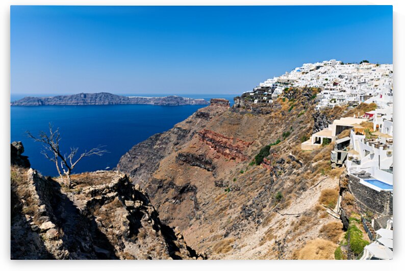 Picturesque Santorini: white village blue sea volcanic cliffs. by Marco Brivio