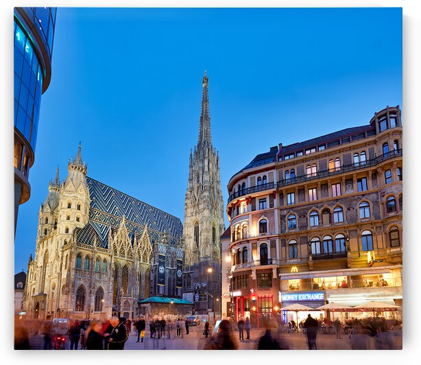 St. Stephens Cathedral at dusk in bustling Vienna. by Marco Brivio