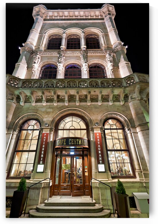 Grand Cafe Central building illuminated at night. by Marco Brivio