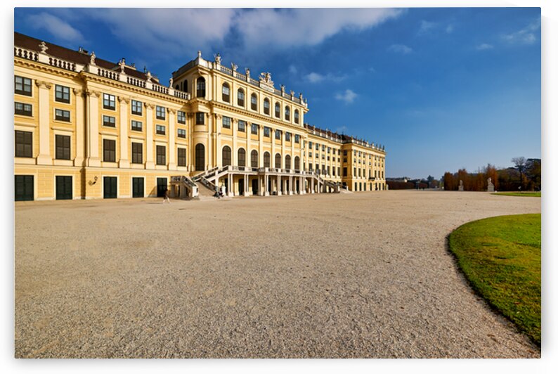 Majestic yellow palace gravel courtyard blue sky. by Marco Brivio