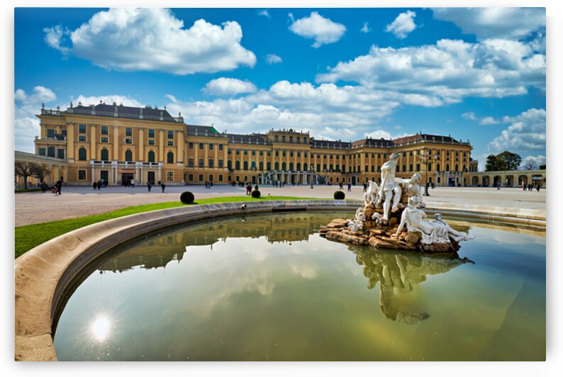 Schönbrunn Palace Vienna with Neptune Fountain and blue sky. by Marco Brivio