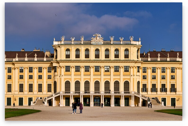 Ornate yellow palace facade with people and blue sky. by Marco Brivio