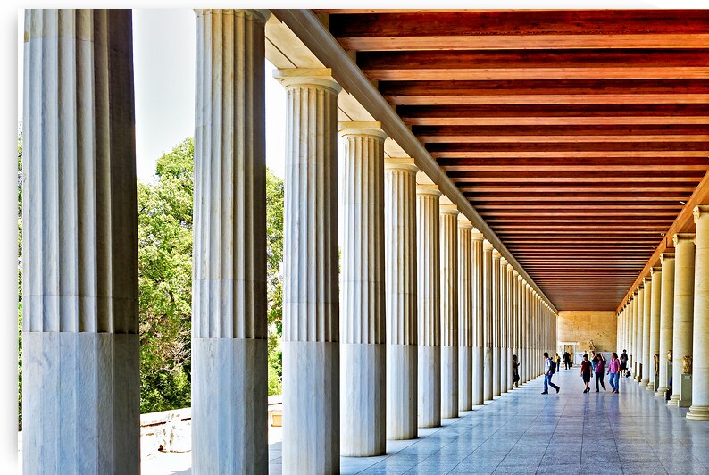 Visitors walking through the Stoa of Attalos in Athens Greece by Marco Brivio