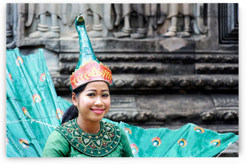 Smiling Cambodian dancer in traditional peacock costume at templ by Marco Brivio