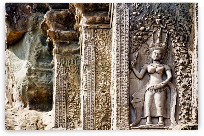 Ancient Cambodian temple carving of an Apsara. by Marco Brivio