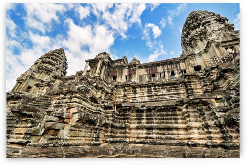 Angkor Wat temple ancient stone architecture against blue sky. by Marco Brivio