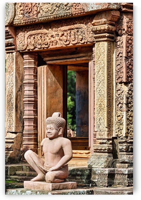Ancient Cambodian temple with intricate carvings and stone statu by Marco Brivio
