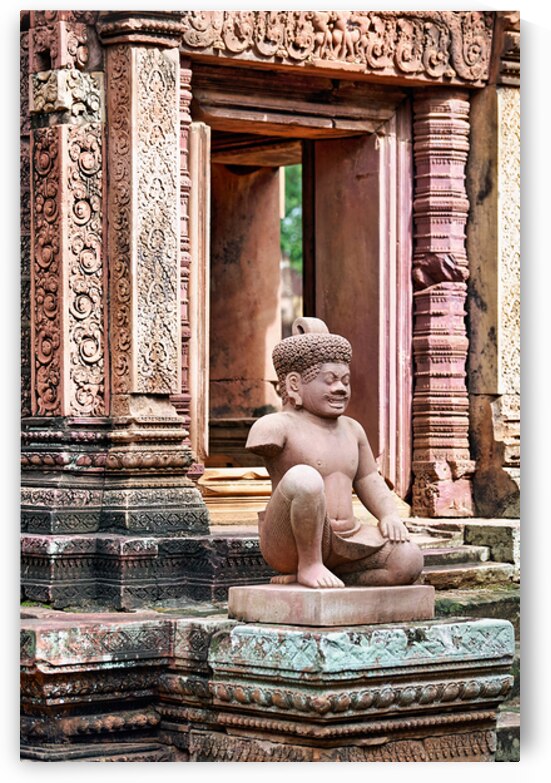 Ancient Khmer temple with detailed carvings and a stone guardian by Marco Brivio