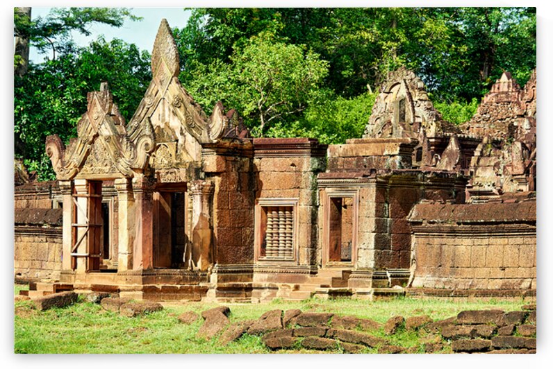 Ancient Banteay Srei temple ruins with intricate carvings and gr by Marco Brivio