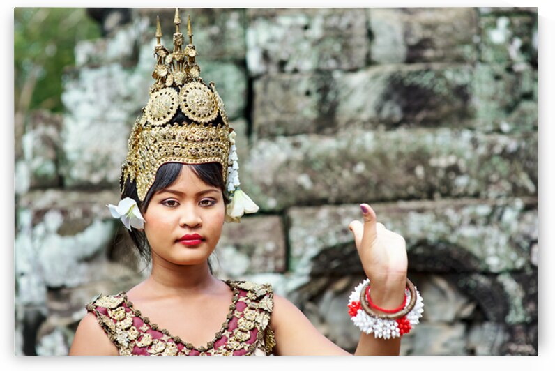 Cambodian dancer in traditional costume and golden headdress. by Marco Brivio