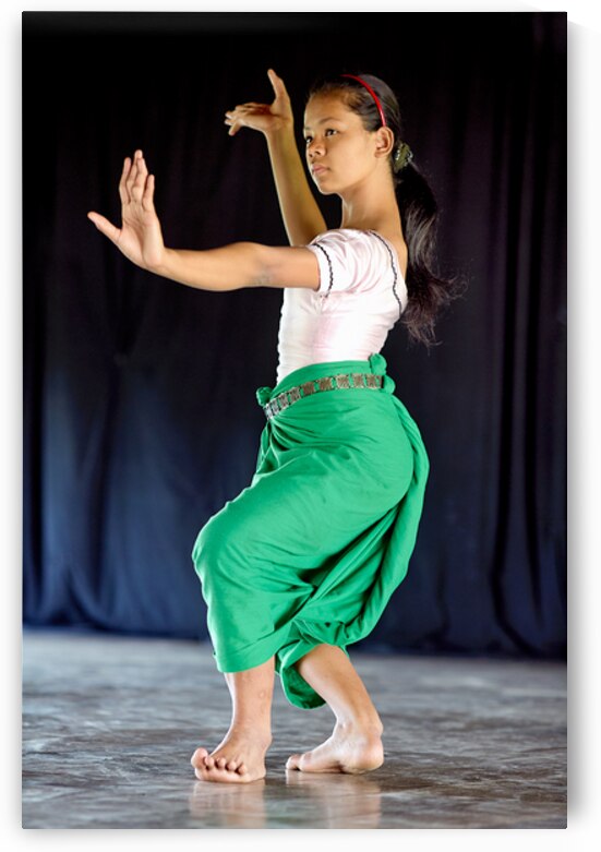 Young girl performing traditional dance. by Marco Brivio
