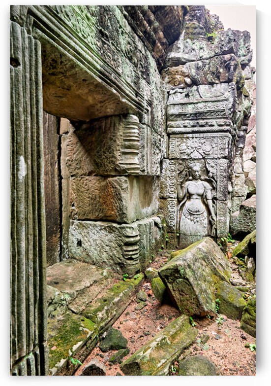 Ancient temple ruins with carved stone deity and moss. by Marco Brivio