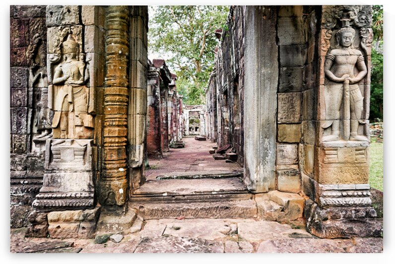 Ancient stone temple ruins with carved figures. by Marco Brivio