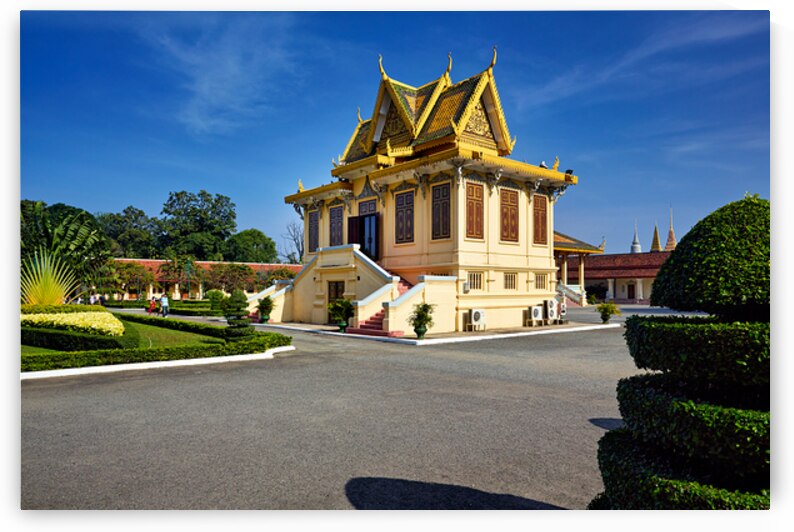 Ornate golden roofed Cambodian building in a sunny garden settin by Marco Brivio