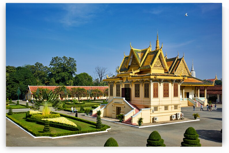 Golden roofed Cambodian palace manicured gardens and clear blu by Marco Brivio