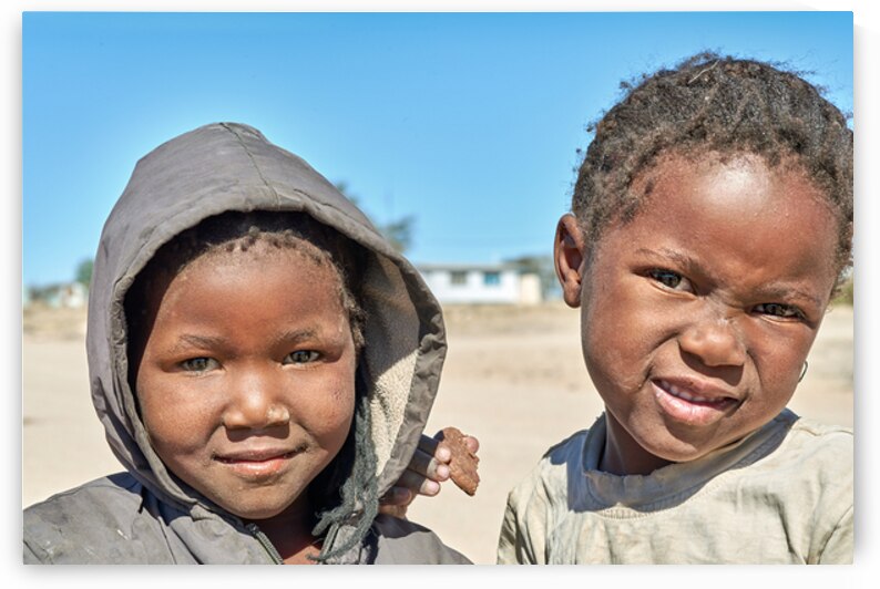 Children in Damaraland village of Namibia share a moment togethe by Marco Brivio