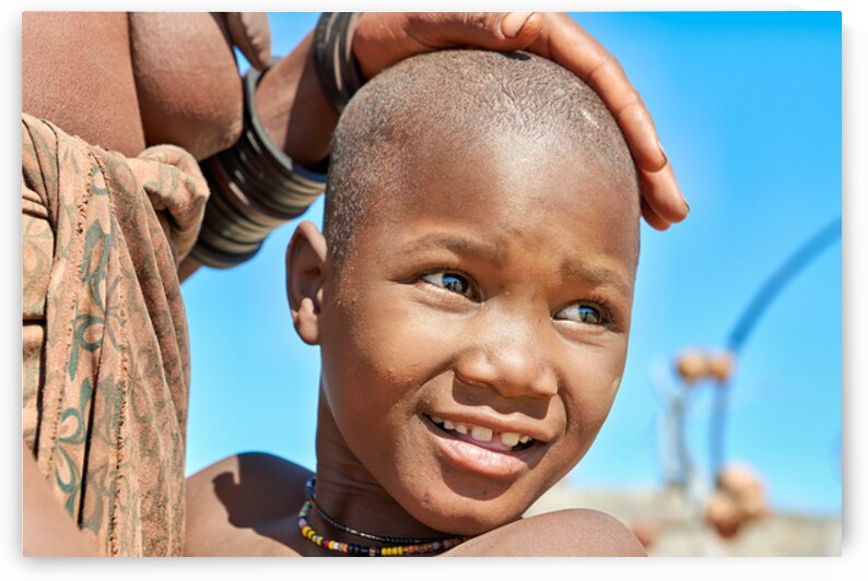 Portrait of Himba child in Kunene region of Namibia during dayti by Marco Brivio