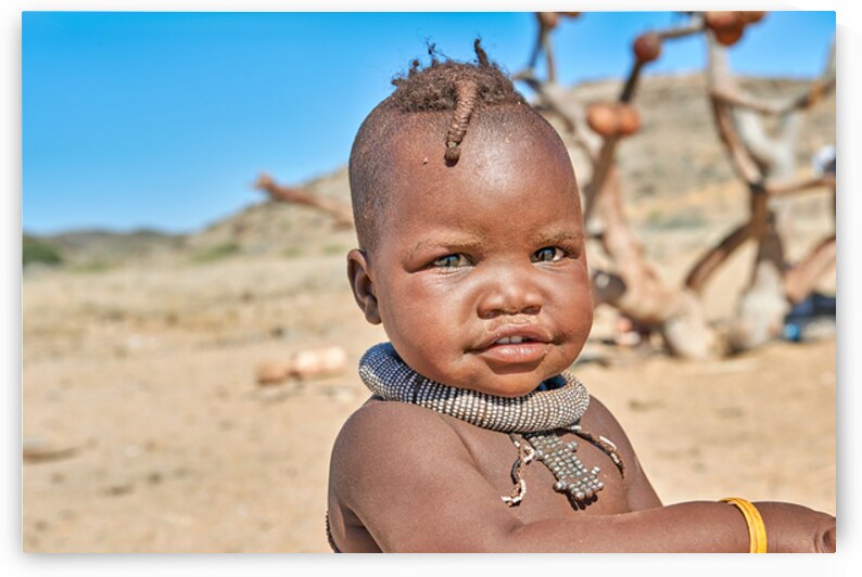 Portrait of Himba child in Kunene region of Namibia by Marco Brivio