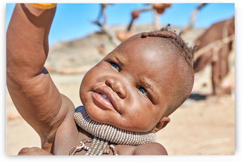 Portrait of Himba child in Kunene region of Namibia by Marco Brivio