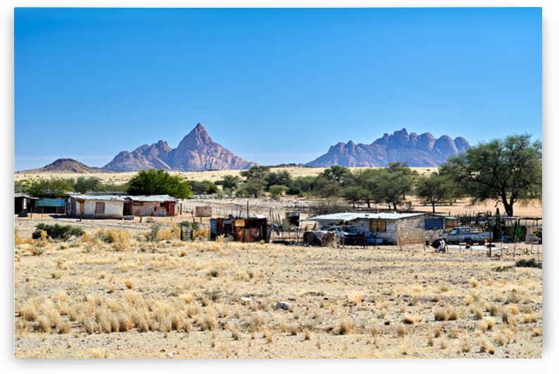 Village near Spizkoppe granite peaks in Namibias Namib Desert by Marco Brivio
