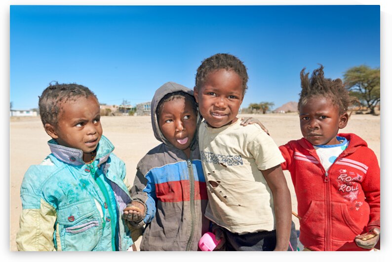 Group of children in Damaraland Namibia on a sunny day by Marco Brivio