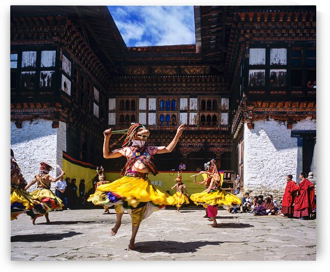 Bhutanese masked dancers perform traditional dance at a monaster by Marco Brivio