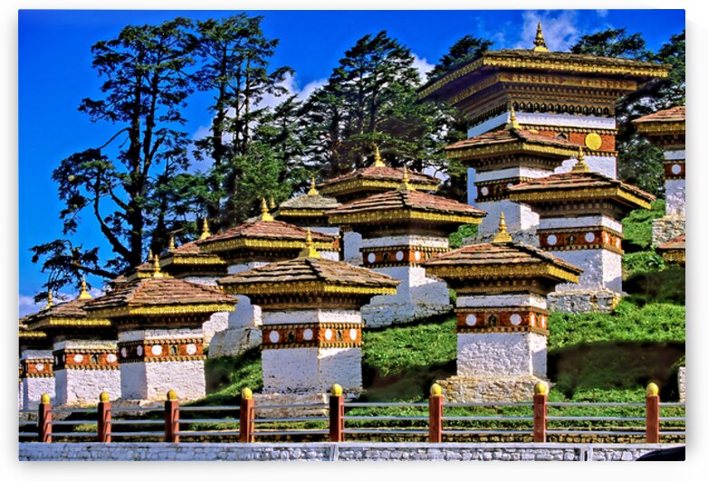 Druk Wangyal Chortens Bhutan with lush trees and blue sky. by Marco Brivio
