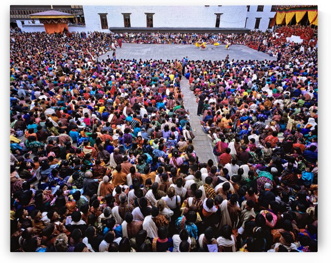 Large crowd watches traditional dance performance at outdoor fes by Marco Brivio