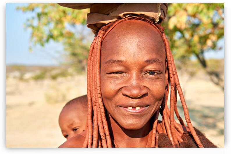 Smiling Himba woman and baby in Kunene region of Namibia by Marco Brivio