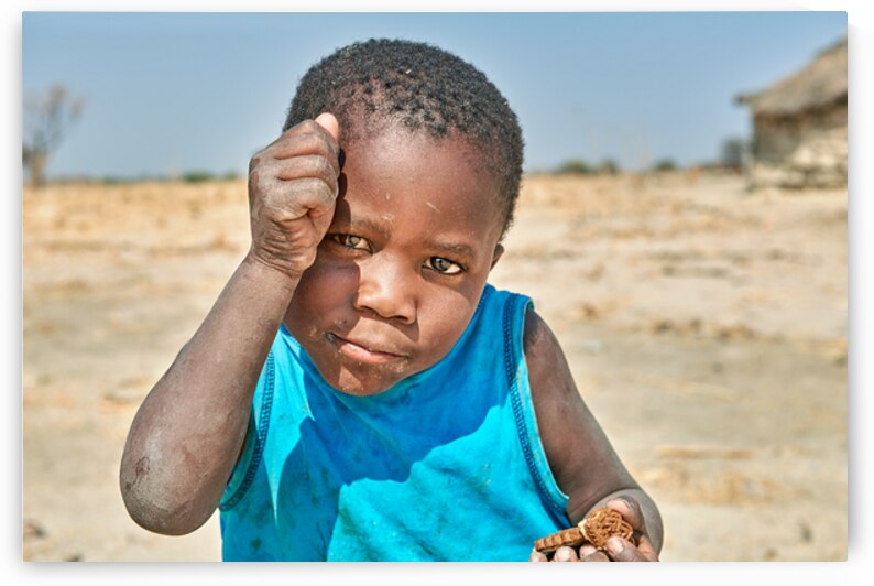 Joyful boy in Kavango Region playing in Namibia by Marco Brivio