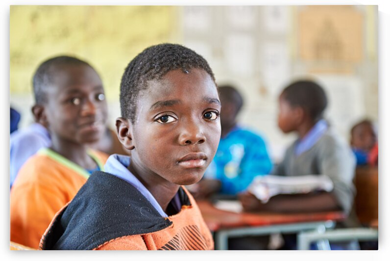 Student at desk in classroom in Rundu Kavango Region Namibia by Marco Brivio