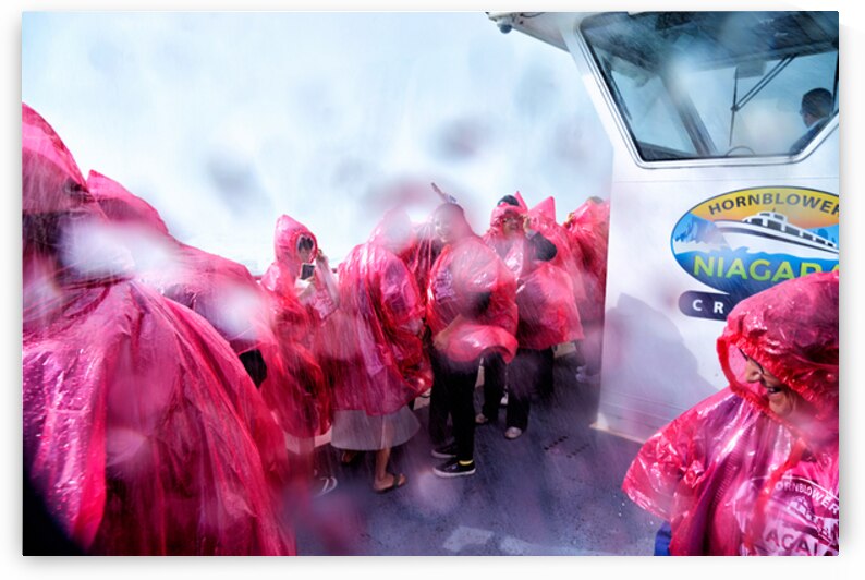 Pink ponchoed tourists on a misty Hornblower Niagara Falls cruis by Marco Brivio