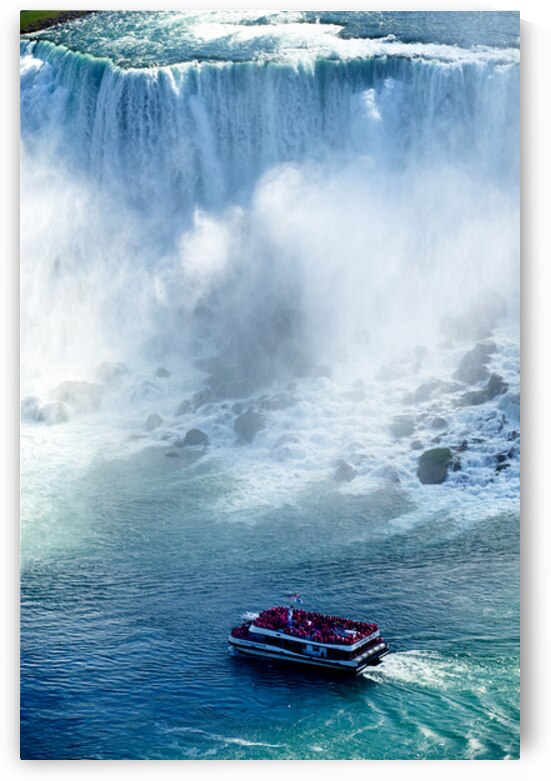 Tourists on a boat near Niagara Falls. by Marco Brivio
