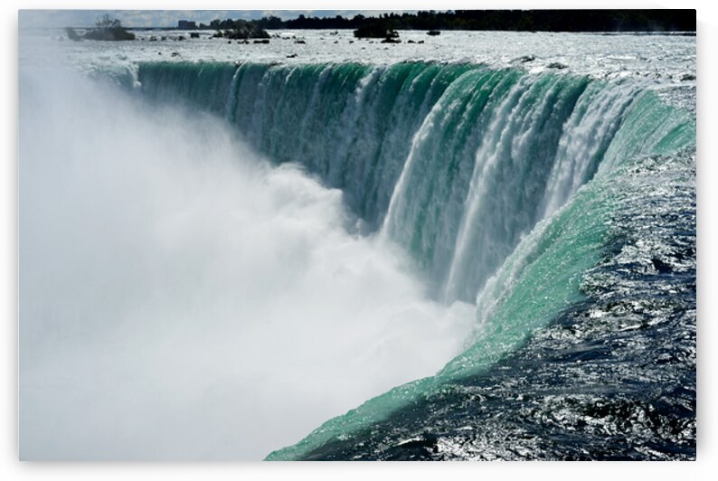 Powerful Niagara Falls cascading creating immense mist. by Marco Brivio