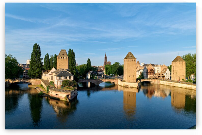 Covered bridges in Strasbourg by the river on a clear day by Marco Brivio