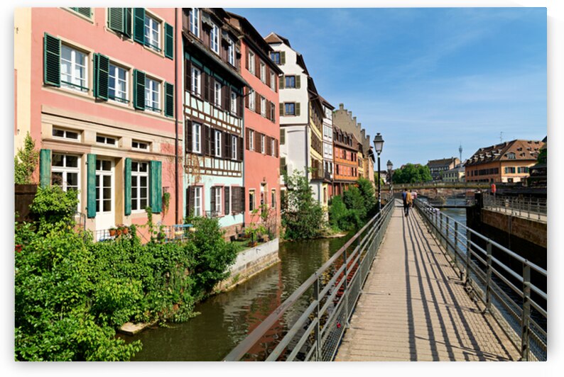 Visitors walk along the canal in Petit France Strasbourg by Marco Brivio