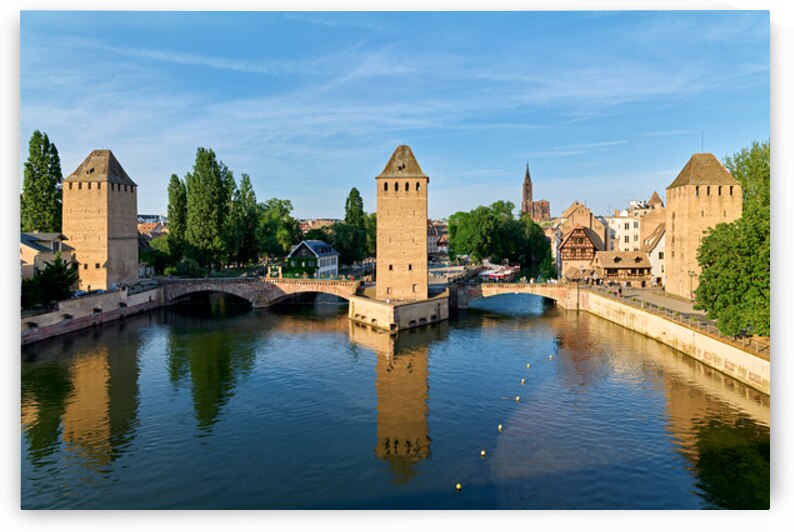 Covered bridges connect towers over water in Strasbourg Alsace by Marco Brivio