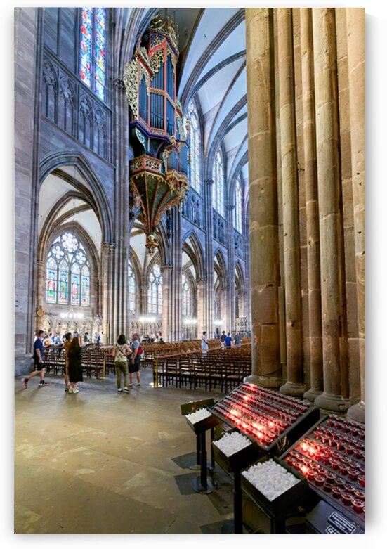 Visitors explore Strasbourg Cathedral with the grand organ pipe by Marco Brivio