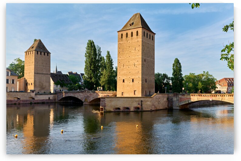 Exploring covered bridges in Strasbourg on a clear day by Marco Brivio