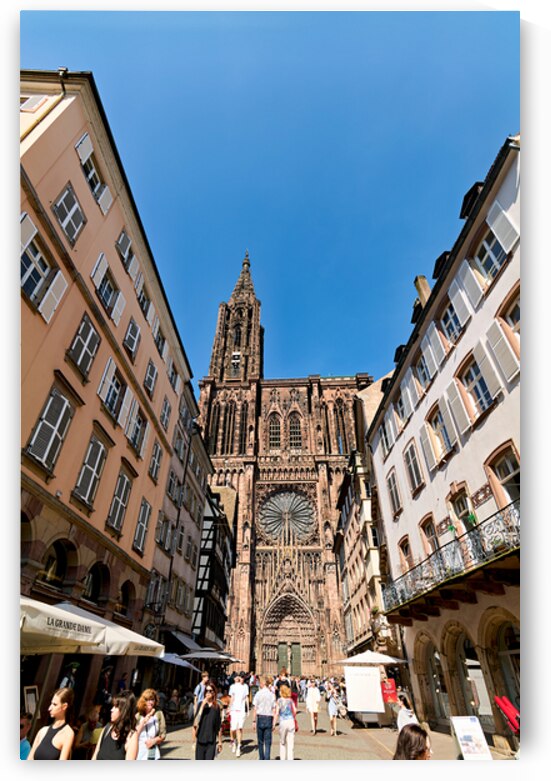Visitors stroll by the Cathedral in sunny Strasbourg by Marco Brivio