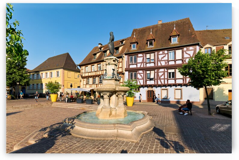 Visitors enjoy warm day at fountain in Petite Venise Colmar by Marco Brivio