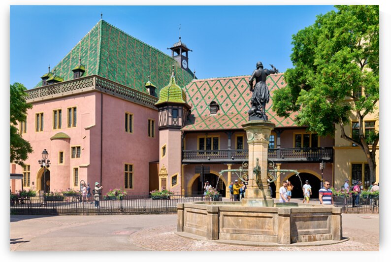 Visitors explore the square at Koifhus in Colmar Alsace France by Marco Brivio